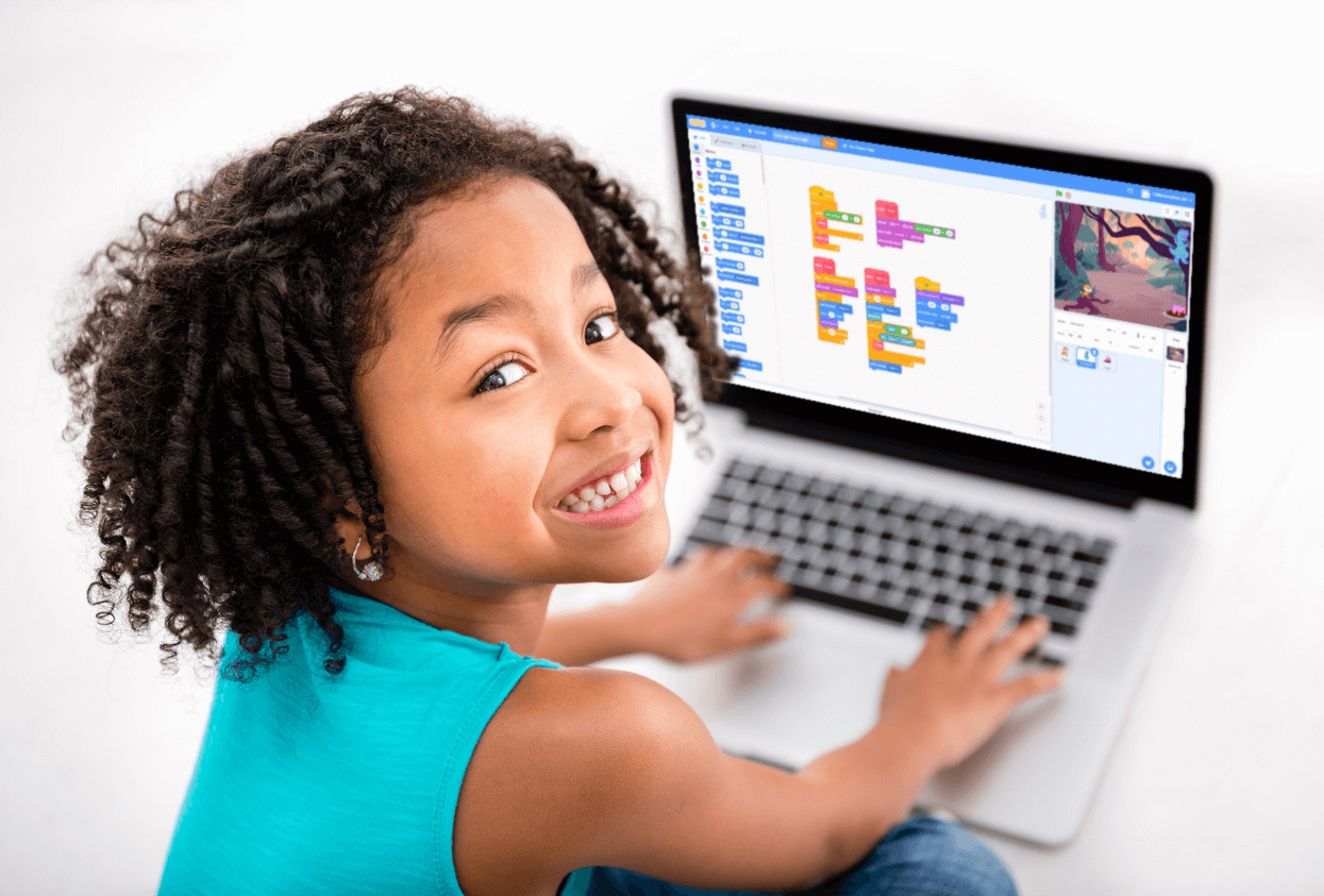 A child learning to code on a laptop